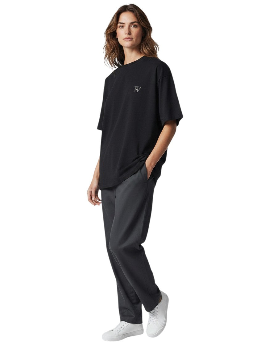 Fourthwave black 100% cotton oversized t-shirt with embroidered logo on chest, worn by a male model.