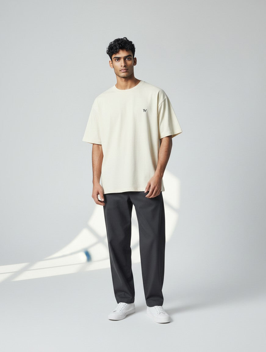 Fourthwave Unisex oversized classic t-shirt in cream, made from 100% cotton with a small black logo.