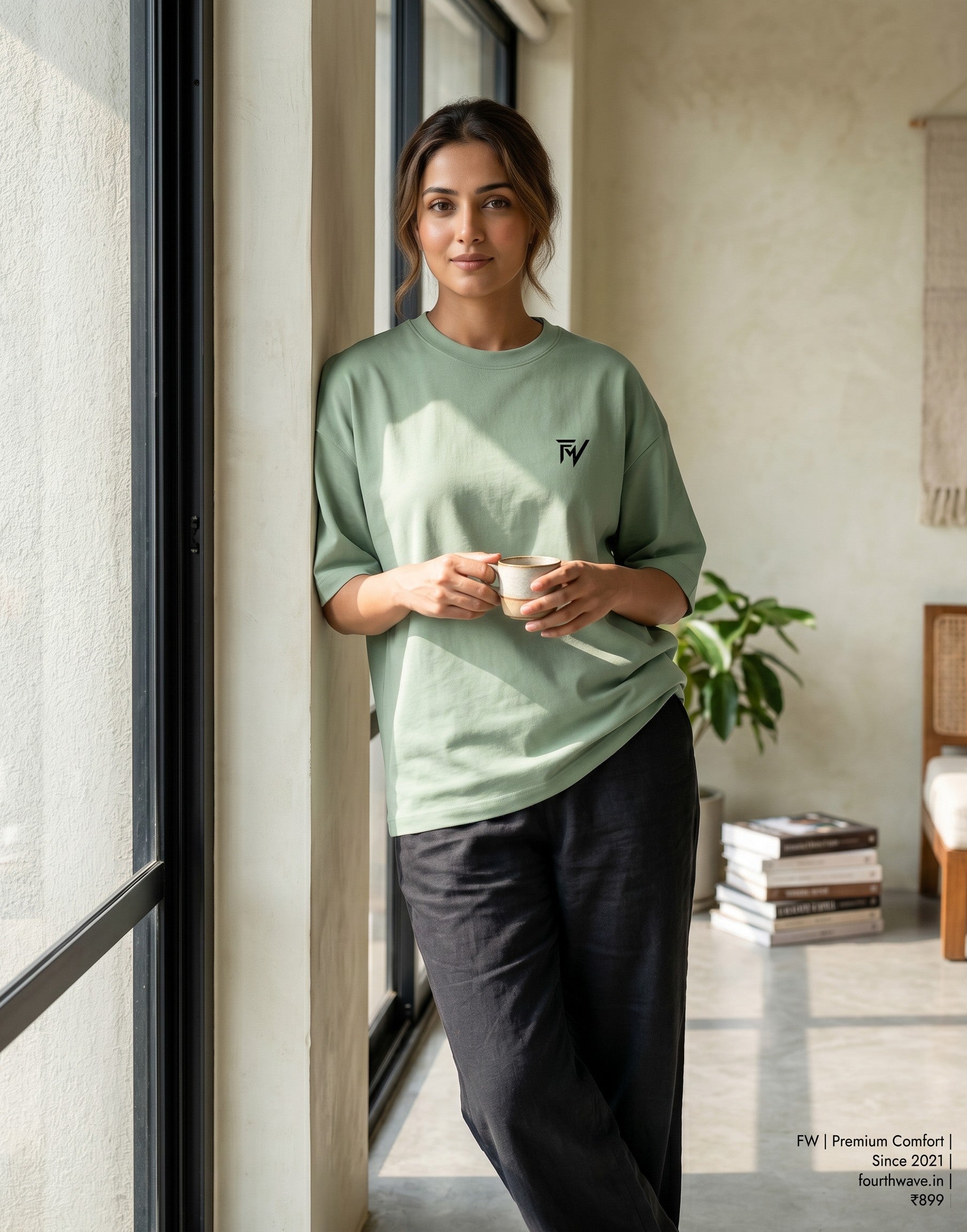 Fourthwave light green unisex oversized tee made from 90/10 cotton polyester terry-knit with drop shoulders and a small black logo on the chest.