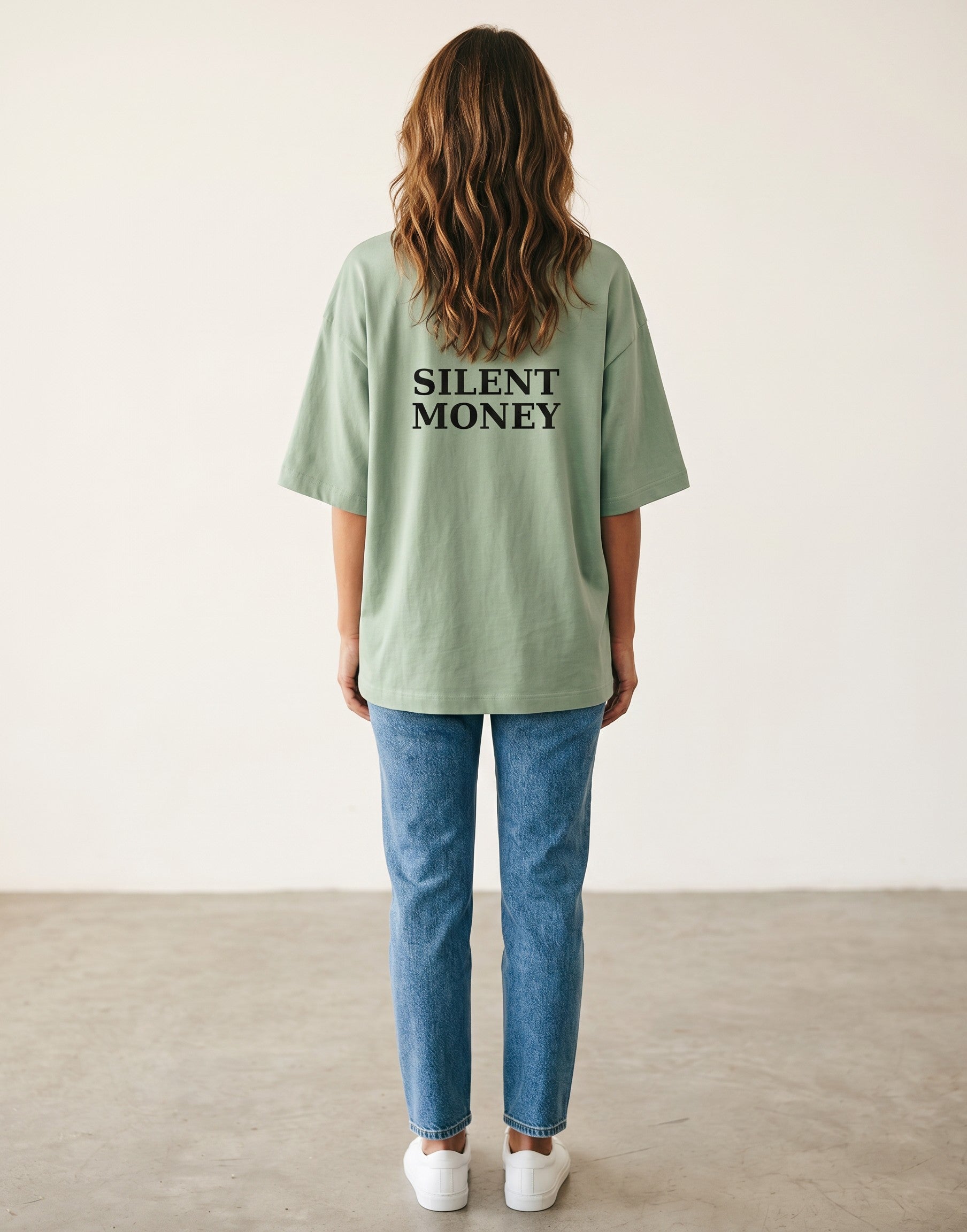 Fourthwave light green oversized terry knit t-shirt with drop shoulders and black "SILENT MONEY" graphic on back.