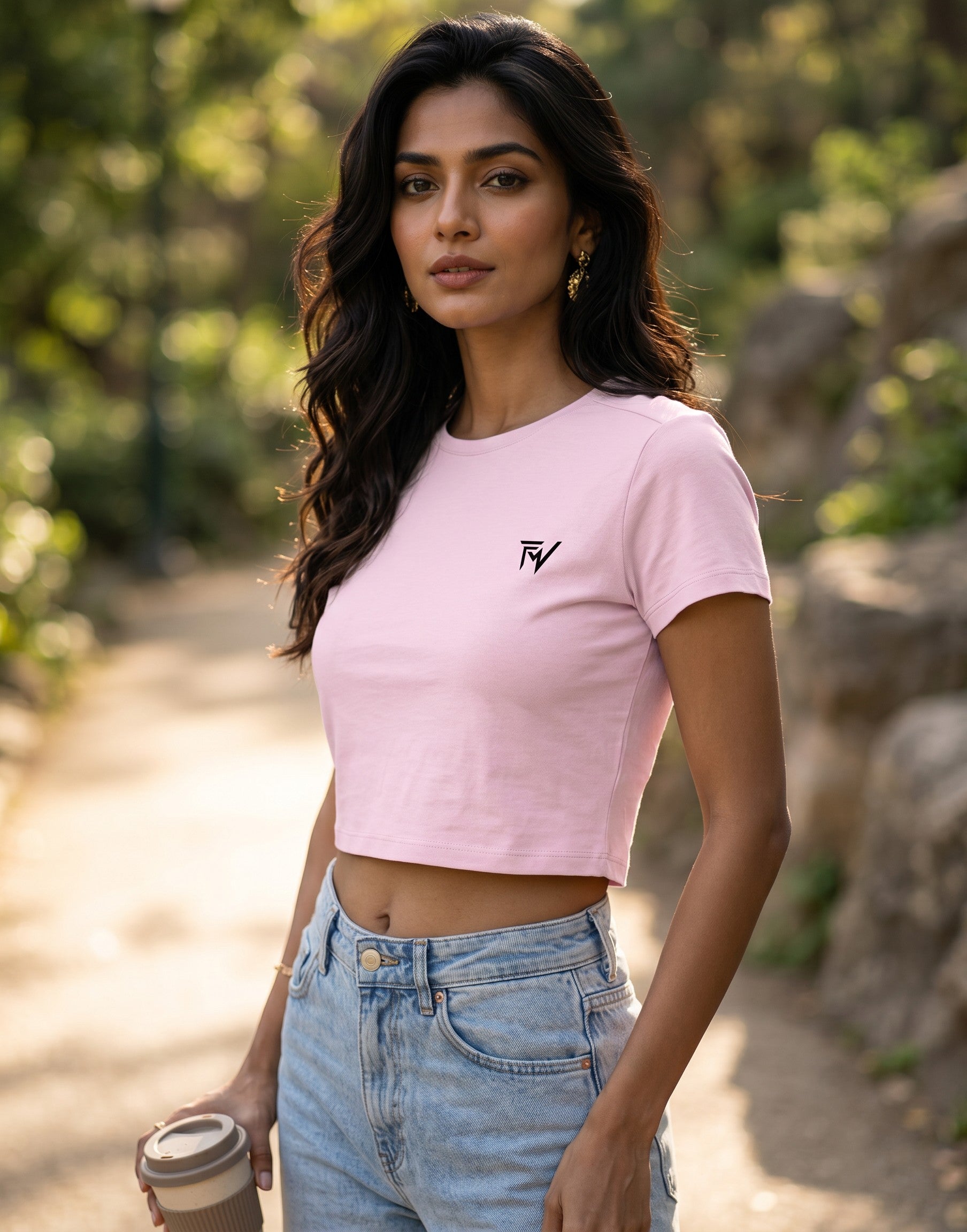 Fourthwave light pink cropped baby tee made from a soft cotton-spandex blend with a bio-wash finish and a small black logo.
