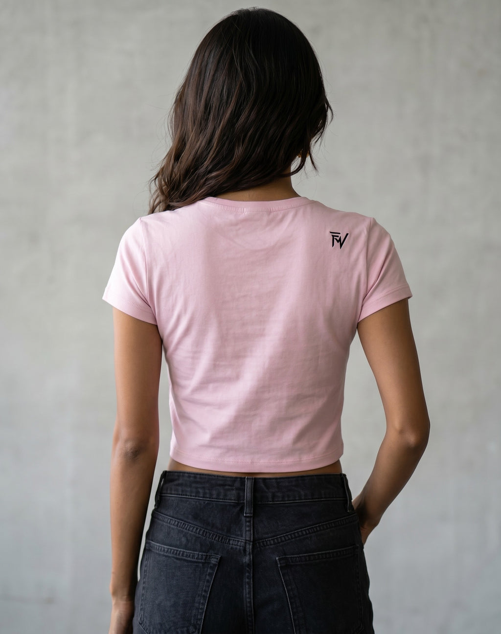 Fourthwave pastel pink cropped t-shirt with crew neck and embroidered logo on chest, worn by a model.